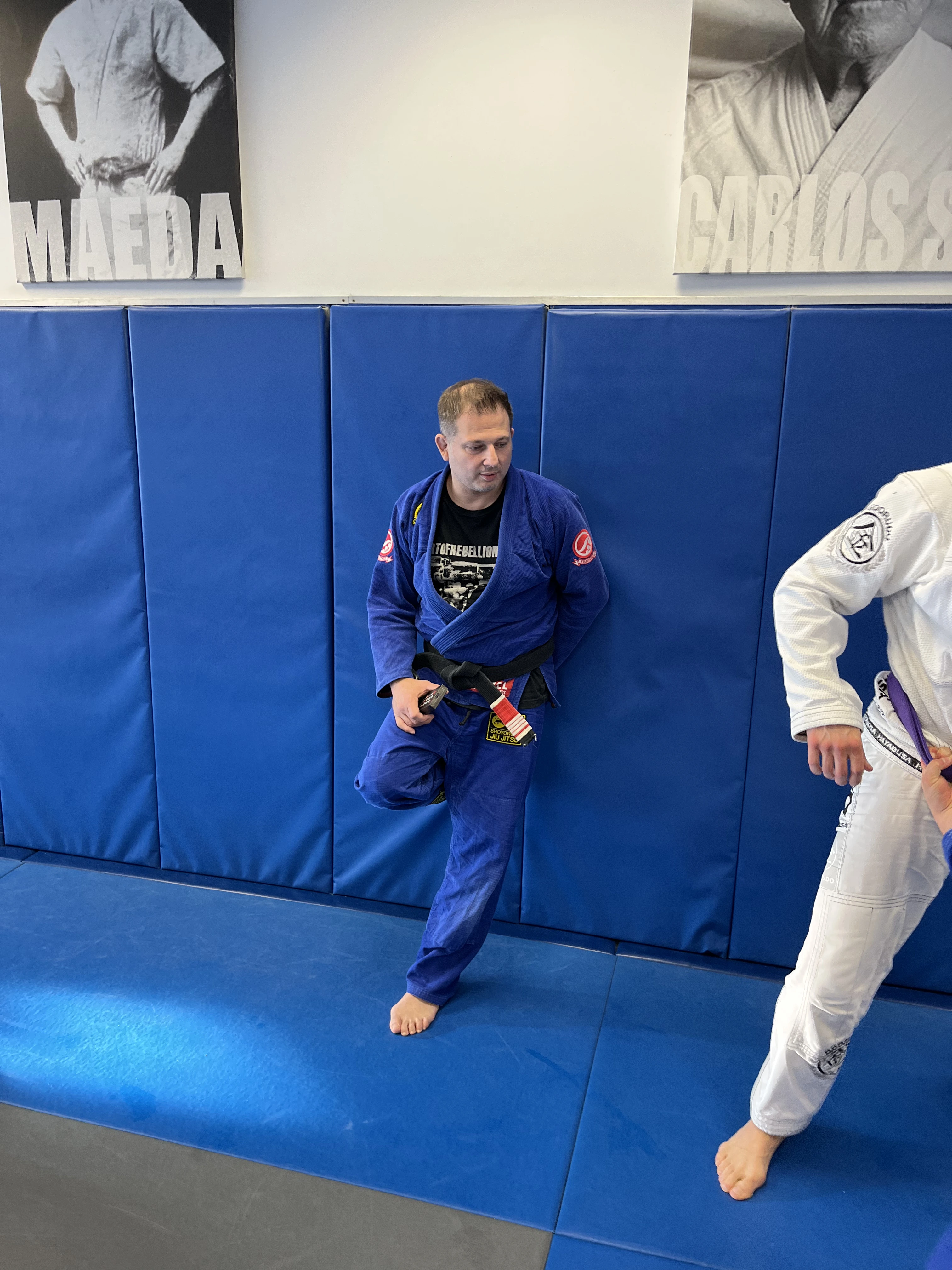Instructor working with an adult student during a Gracie Jiu-Jitsu class at Performance Jiu-Jitsu in Fair Lawn, NJ